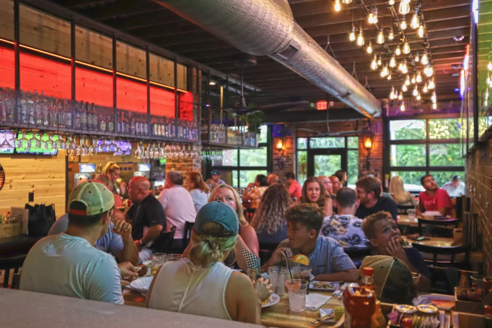 Guests enjoying the dining room and bar inside Brick House Gastropub